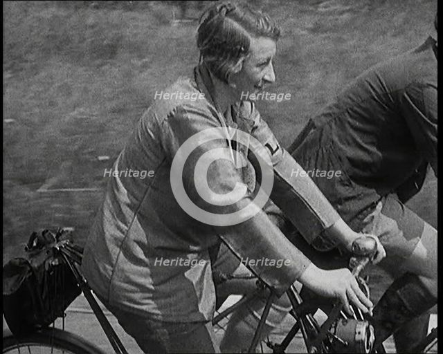 Large Group of Civilians Riding Bicycles Through Country Lanes, 1931. Creator: British Pathe Ltd.