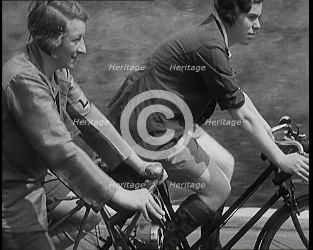 Large Group of Civilians Riding Bicycles Through Country Lanes, 1931. Creator: British Pathe Ltd.