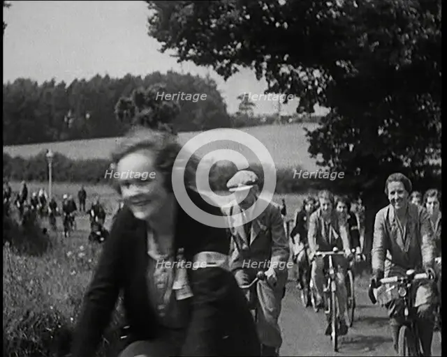 Large Group of Civilians Riding Bicycles Through Country Lanes, 1931. Creator: British Pathe Ltd.