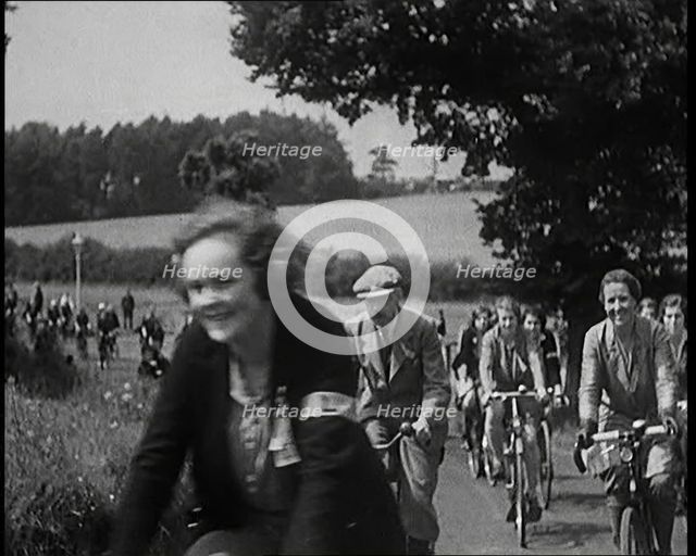 Large Group of Civilians Riding Bicycles Through Country Lanes, 1931. Creator: British Pathe Ltd.