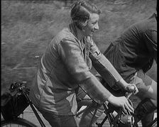 Large Group of Civilians Riding Bicycles Through Country Lanes, 1931. Creator: British Pathe Ltd