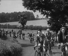 Large Group of Civilians Riding Bicycles Through Country Lanes, 1931. Creator: British Pathe Ltd