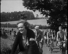 Large Group of Civilians Riding Bicycles Through Country Lanes, 1931. Creator: British Pathe Ltd