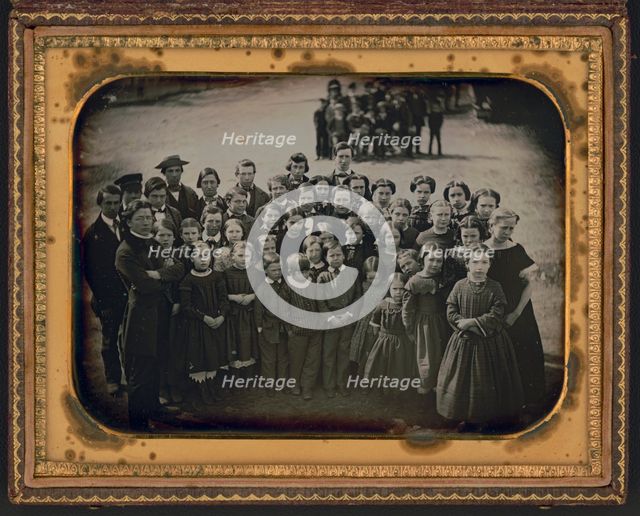 Large group of school children, with their teacher, standing in a town street, ca. 1850s. Creator: Unknown.