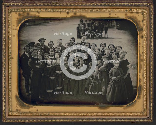 Large group of school children, with their teacher, standing in a town street, ca. 1850s. Creator: Unknown.