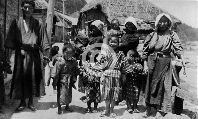''Large family of young fisherman at Nabuto, with nine children', c1900, (1921). Artist: Julian Leonard Street.