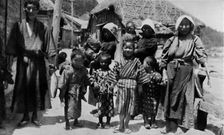 'Large family of young fisherman at Nabuto, with nine children c1900, (1921). Artist: Julian Leonard Street