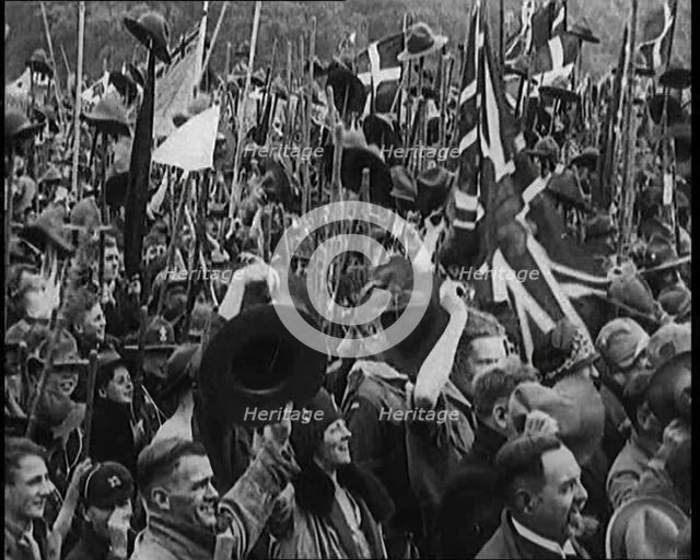 Large Numbers of Boy Scouts and Male Civilians Cheering at Jamboree, 1929. Creator: British Pathe Ltd.