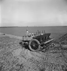 Large-scale, mechanized farming - potato planter, Kern County, California, 1939. Creator: Dorothea Lange