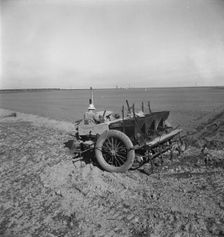 Large-scale, mechanized farming - potato planter, Kern County, California, 1939. Creator: Dorothea Lange