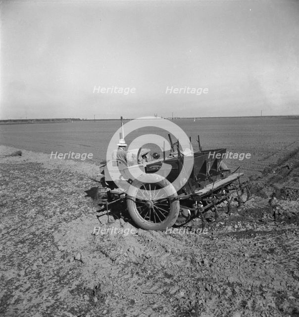 Large-scale, mechanized farming - potato planter, Kern County, California, 1939. Creator: Dorothea Lange.