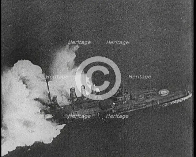 Large Warship Being Hit by an Exploding Shell, 1921. Creator: British Pathe Ltd.