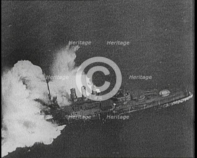Large Warship Being Hit by an Exploding Shell, 1921. Creator: British Pathe Ltd.