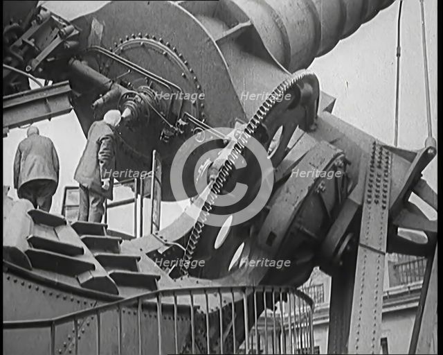Large Telescope Being Turned by Two Civilians, 1931. Creator: British Pathe Ltd.