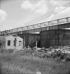 Large turpentine still and processing plant near Valdosta, Georgia, 1937. Creator: Dorothea Lange