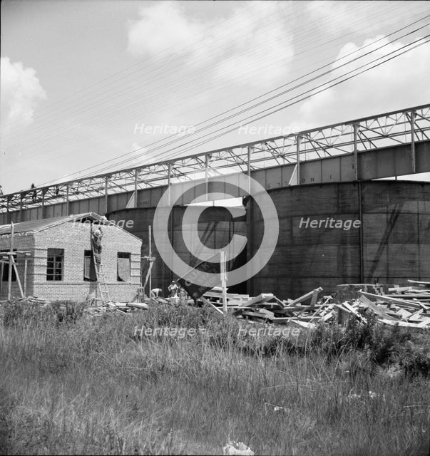 Large turpentine still and processing plant near Valdosta, Georgia, 1937. Creator: Dorothea Lange.