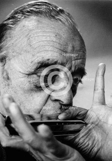Larry Adler (1914-2001), Musician, playing his harmonica, 1992. Creator: Unknown.