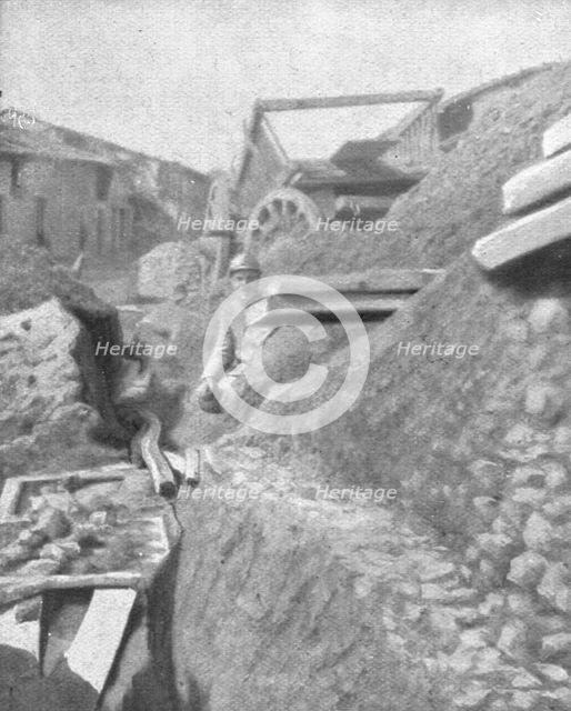 'Le Champ de Bataille; L'entrée de Cumieres, a l'Est du Mort-Homme, defendue..., 1916 (1924) Creator: Unknown.