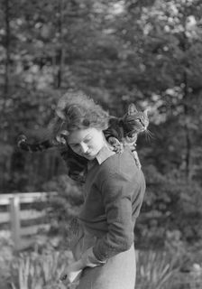 Le Gallienne, Eva, with cat, outdoors, 1937 Creator: Arnold Genthe