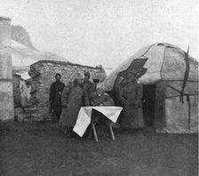 Le general Kalitine, commandant d'un des corps d'armee, suit sur la carte le rapport d'un..., 1916. Creator: Unknown