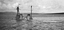 Le sabordage de la flotte allemande; Le "Hindenburg" repose sur le fond; les cheminees..., 1919. Creator: Unknown