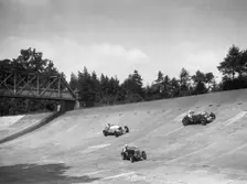Lea-Francis 1496 cc, MG M type and Invicta 4467 cc racing on the Members Banking at Brooklands. Artist: Bill Brunell