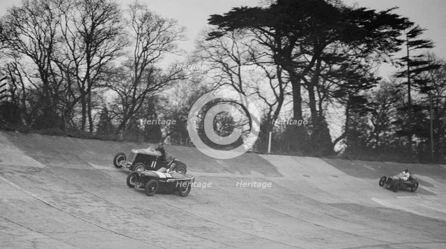 Lea-Francis Hyper of AS Llewellyn and Amilcar of Major A Gardner, BARC meeting, Brooklands, 1930. Artist: Bill Brunell.