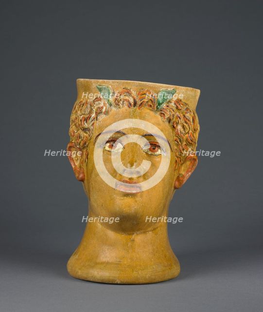 Lead-Glazed Head Kantharos, 1st century B.C. Creator: Likinnios.