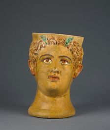 Lead-Glazed Head Kantharos, 1st century B.C. Creator: Likinnios