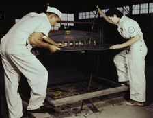 Learning to work a cutting machine, these two NYA employees...Corpus Christi, Texas, 1942. Creator: Howard Hollem