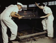 Learning to work a cutting machine, these two NYA employees...Corpus Christi, Texas, 1942. Creator: Howard Hollem
