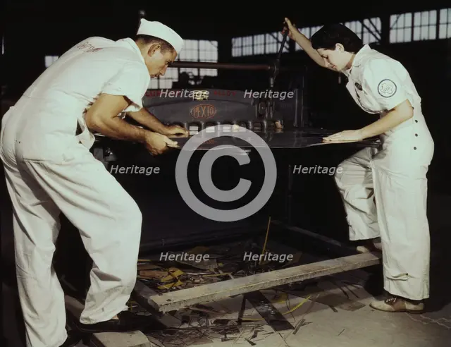 Learning to work a cutting machine, these two NYA employees...Corpus Christi, Texas, 1942. Creator: Howard Hollem.