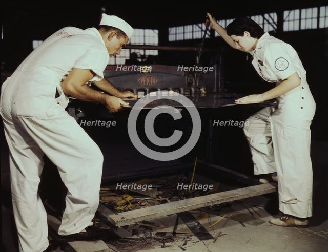 Learning to work a cutting machine, these two NYA employees...Corpus Christi, Texas, 1942. Creator: Howard Hollem.