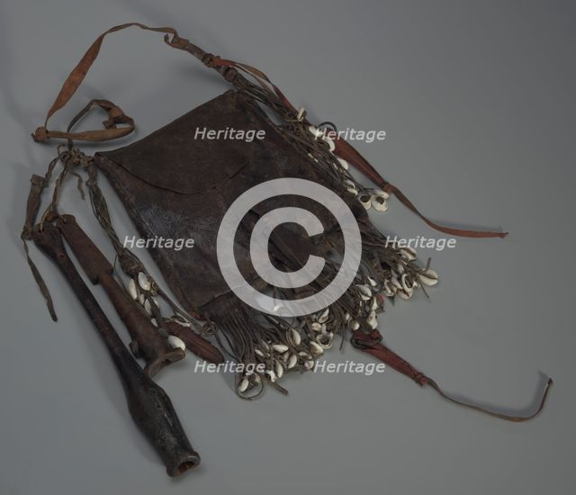 Leather bag with tools, whistles, and shells, 20th Century. Creator: Unknown.