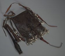Leather bag with tools, whistles, and shells, 20th Century. Creator: Unknown