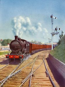 Leaving Dublin. Great Southern Railways train, hauled by a 4-4-0 passenger express 1935. Creator: Unknown