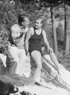 Lee, Margaret, Miss, and unidentified man, seated outdoors, 1927 Creator: Arnold Genthe