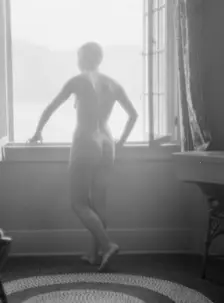 Lee, Margaret, Miss, standing at a window, 1927 Creator: Arnold Genthe