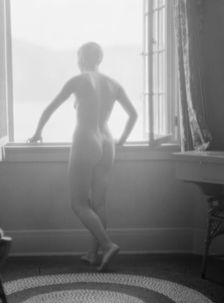 Lee, Margaret, Miss, standing at a window, 1927 Creator: Arnold Genthe