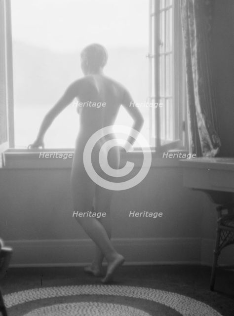 Lee, Margaret, Miss, standing at a window, 1927 Creator: Arnold Genthe.