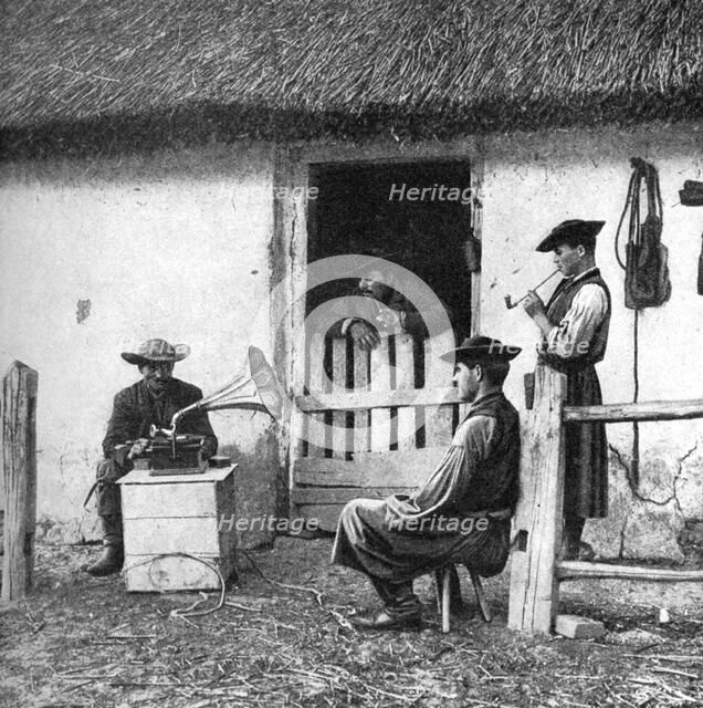 Leisure time for cowherds, Hungary, 1922.Artist: AW Cutler