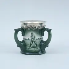Lenox hand-painted three-handled toasting mug with silver rim, c1902. Creator: Unknown