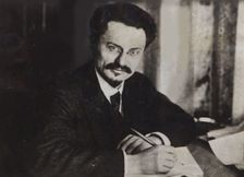 Le?on Trotsky at his writing desk , Early 1920s. Creator: Anonymous