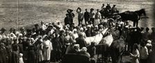 Leon Trotsky underway at a village, 1924