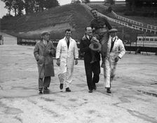 Leon Cushman being carried aloft after making a successful speed record attempt, Brooklands, 1931. Artist: Bill Brunell