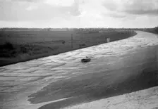 Leon Cushman's Austin 7 racer making a speed record attempt, Brooklands, 8 August 1931. Artist: Bill Brunell