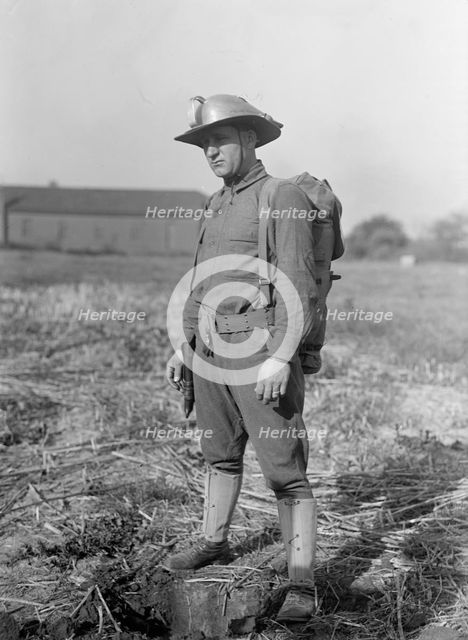 Leonard D.Mahon with Steel Helmet He Invented That Could Be Used As Shovel, 1917. Creator: Harris & Ewing.