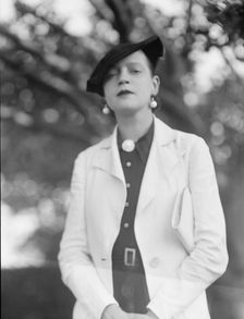 Leonard, Mrs., standing outdoors, between 1926 and 1938. Creator: Arnold Genthe