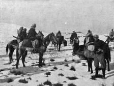 'Les Alpins Marocains; Mokhazenis a cheval, emportant leurs skis en travers de la selle c1916. Creator: Unknown