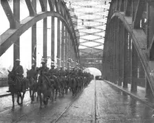 Les Anglais sur le Rhin; A Cologne, Lanciers britanniques passant le Rhin a Cologne..., 1918. Creator: Jean Clair-Guyot